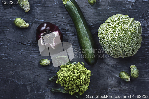 Image of Organic vegetables on wooden table. Top view