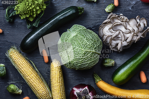 Image of Organic vegetables on wooden table. Top view