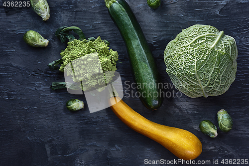 Image of Organic vegetables on wooden table. Top view