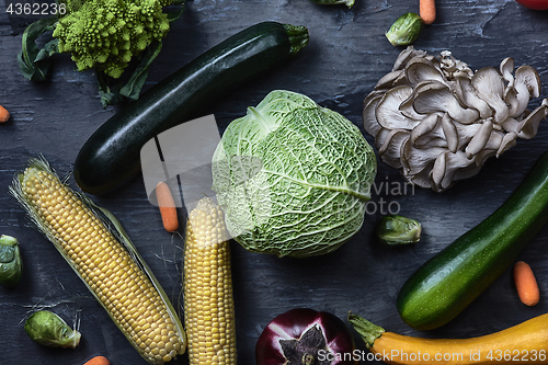 Image of Organic vegetables on wooden table. Top view