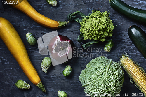 Image of Organic vegetables on wooden table. Top view