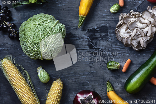 Image of Organic vegetables on wooden table. Top view