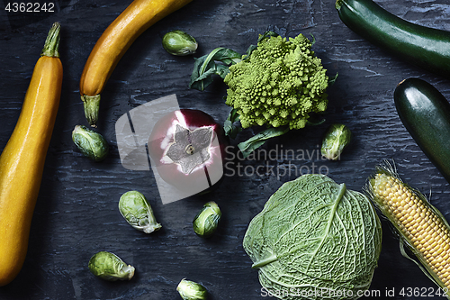 Image of Organic vegetables on wooden table. Top view