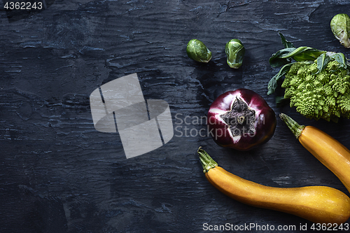 Image of Organic vegetables on wooden table. Top view