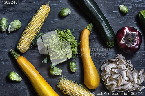 Image of Organic vegetables on wooden table. Top view