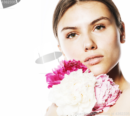 Image of young beauty woman with flower peony pink closeup makeup soft te