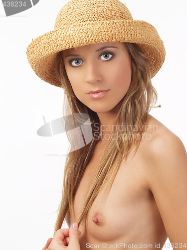 Image of Topless young blond woman in straw hat