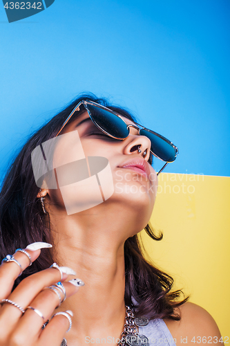 Image of lifestyle people concept. young pretty smiling indian girl with long nails wearing lot of jewelry rings, asian summer happy cool