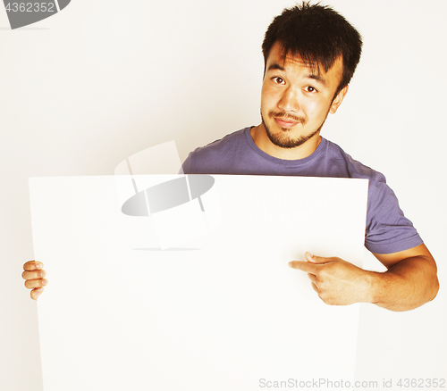 Image of pretty cool asian man holding empty white plate smiling