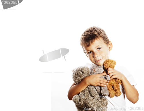 Image of little cute boy with many teddy bears hugging isolated close up