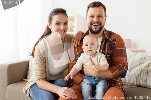 Image of happy family with baby at home