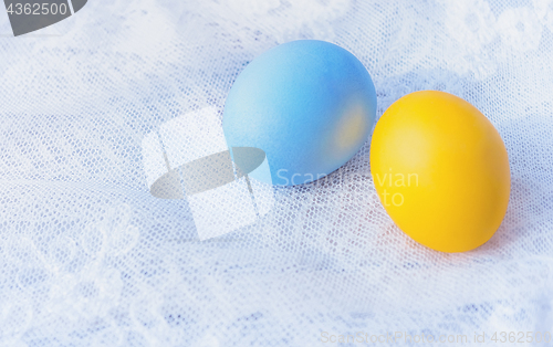 Image of Two Painted Easter Eggs On A Lace