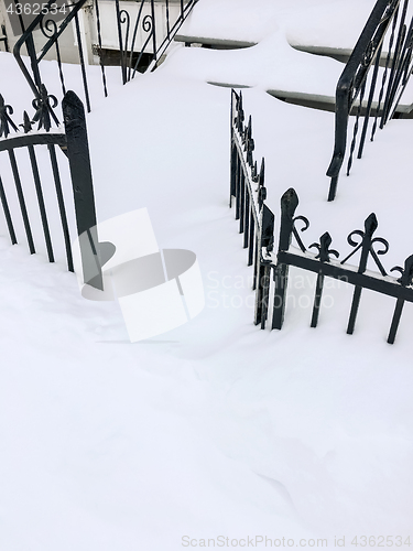 Image of Iron fence in deep snow