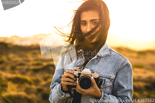 Image of Woman Taking Picture Outdoors