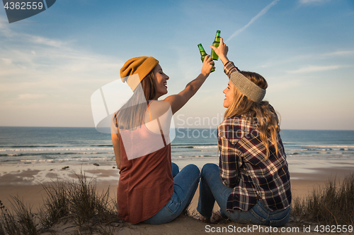 Image of Making a toast on the beach