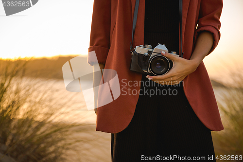 Image of Woman Taking Picture Outdoors