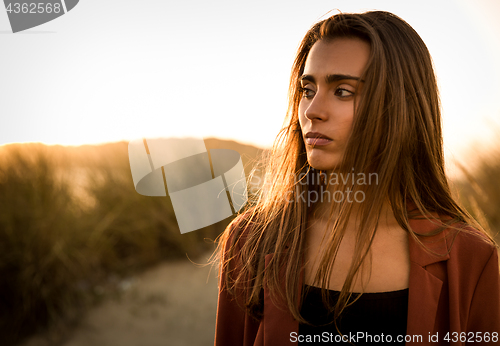 Image of Portrait of a beautiful woman on the beach