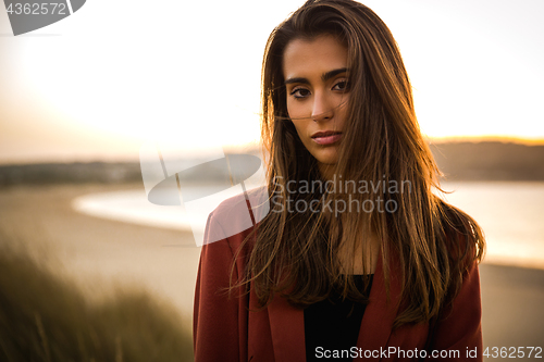 Image of Portrait of a beautiful woman on the beach