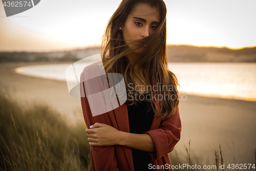 Image of Portrait of a beautiful woman on the beach