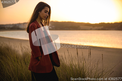 Image of Portrait of a beautiful woman on the beach