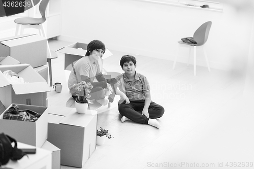 Image of boys with cardboard boxes around them