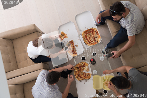 Image of Pizza time a group of people