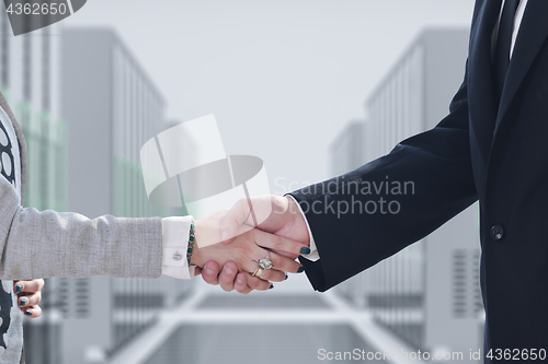 Image of business man and woman handshake on  meeting