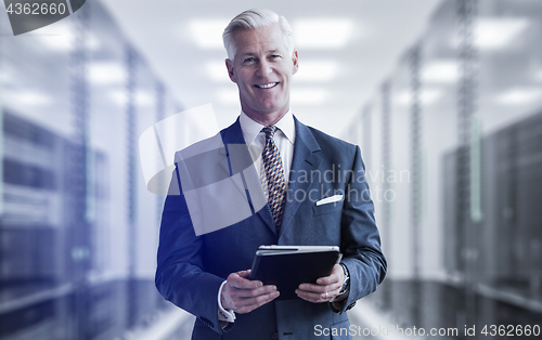 Image of Senior businessman in server room