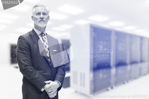 Image of Senior businessman in server room