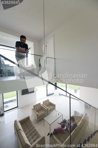 Image of family with little girl enjoys in the modern living room