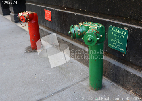 Image of Red and green siamese standpipes