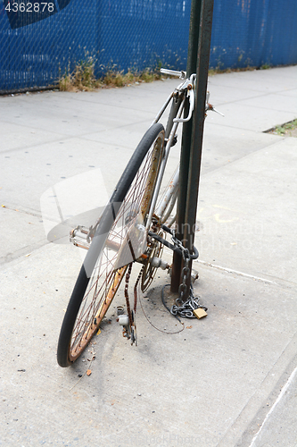 Image of Abandoned broken and rusty bicycle 