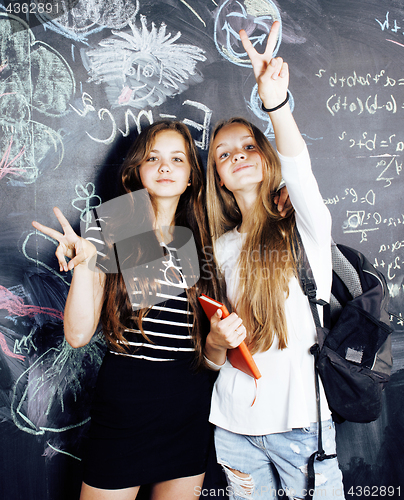 Image of back to school after summer vacations, two teen real girls in cl