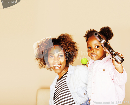 Image of adorable sweet young afro-american mother with cute little daugh