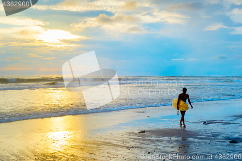 Image of Silhouette of surfer. Bali island