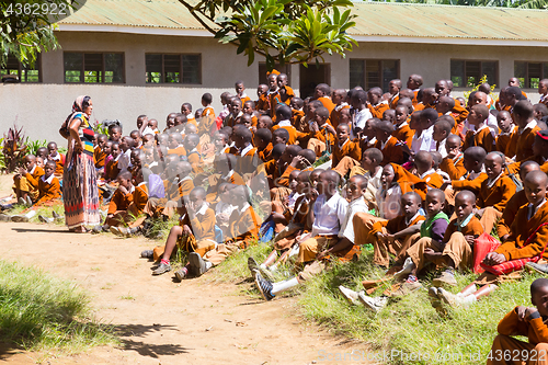 Image of Children in uniforms playing in the cortyard of primary school in rural area near Arusha, Tanzania, Africa.