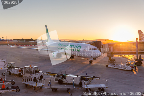 Image of Transavia Jet commercial airplane on Valencia airport at sunset.