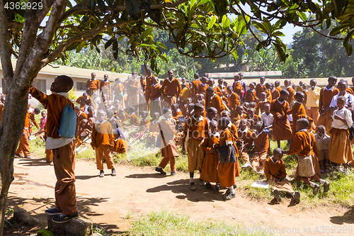 Image of Children in uniforms playing in the cortyard of primary school in rural area near Arusha, Tanzania, Africa.