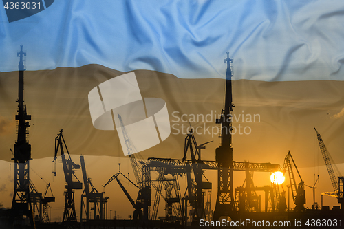 Image of Industrial concept with Estonia flag at sunset