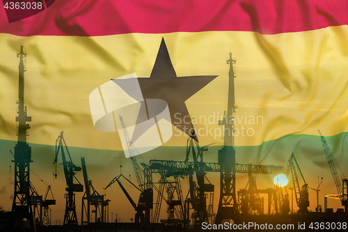 Image of Industrial concept with Ghana flag at sunset