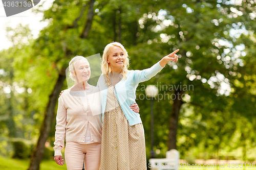 Image of daughter with senior mother at park