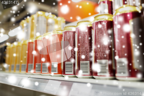 Image of close up of beer or cider cans at liquor store