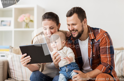 Image of mother, father and baby with tablet pc at home