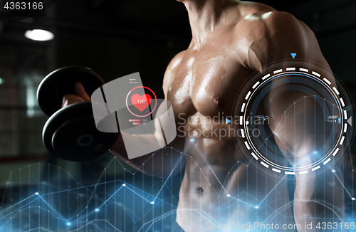 Image of close up of man with dumbbells exercising in gym