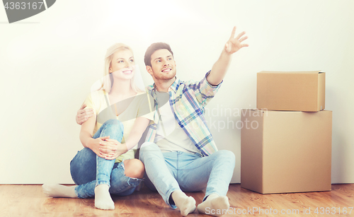 Image of couple with boxes moving to new home and dreaming