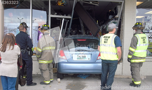 Image of Car into store.