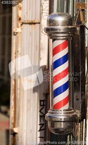 Image of Barber Pole Business Advertisement Downtown