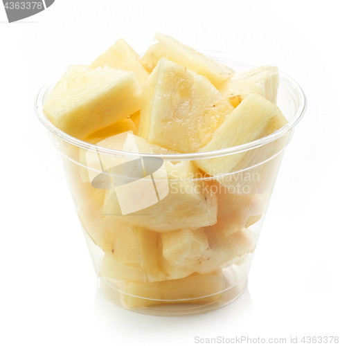 Image of fresh pineapple pieces salad in plastic cup