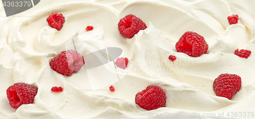 Image of whipped cream with raspberries