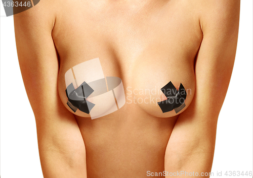Image of beautiful female breast with bondage